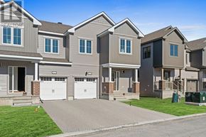 Ottawa townhouse for rent - A row of houses with the words "Coldwell Banker Whitemarsh Realty" on the front.