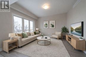 Thorold (Hurricane/Merrittville) apartment for rent - A living room with a couch, a chair, a coffee table, and a television.