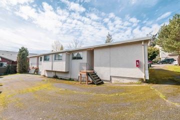 Bellingham apartment for rent - A building with a red fire extinguisher on the side.