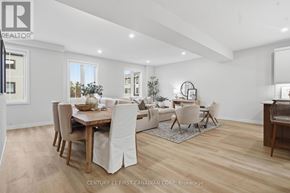 London North (North R) townhouse for rent - A spacious room with wooden flooring and white walls.