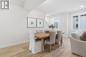 London North (North R) townhouse for rent - A kitchen with wooden cabinets and a white counter top.