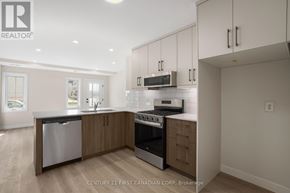 London North (North A) townhouse for rent - A modern kitchen with wooden cabinets and stainless steel appliances.