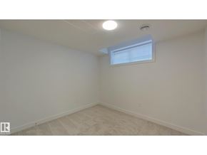 Edmonton apartment for rent - A room with a window and a ceiling light.