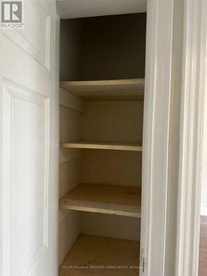 Toronto (Woodbine-Lumsden) apartment for rent - Empty shelves in a white pantry.