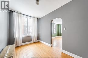 Windsor apartment for rent - A room with a large window and a wooden floor.