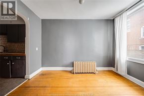 Windsor apartment for rent - A room with a wooden floor and a radiator.
