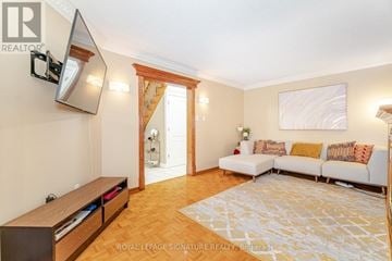 Mississauga (East Credit) apartment for rent - A living room with a white couch and a wooden floor.