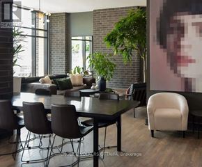 Ottawa condo for rent - A modern dining room with a large table and chairs.
