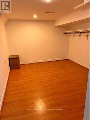 Markham (Victoria Square) apartment for rent - A room with wooden floors and white walls.