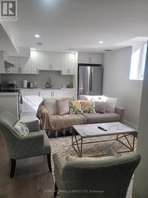 Clarington (Bowmanville) apartment for rent - A living room with a grey couch and a coffee table.