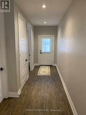 Southwest Middlesex (Wardsville) fourplex for rent - A hallway with wooden floors and white walls.