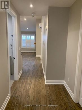 Southwest Middlesex (Wardsville) fourplex for rent - A hallway with wood flooring and white walls.