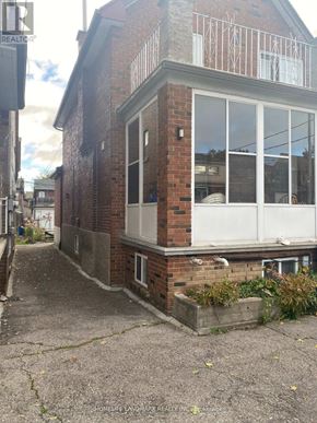 Toronto (Oakwood Village) apartment for rent - A brick house with a balcony and a window.
