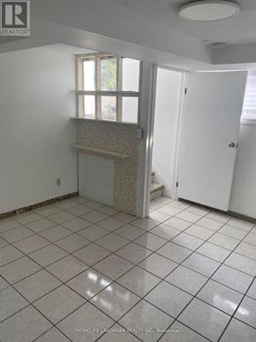 Toronto (Oakwood Village) apartment for rent - A tile floor in a room with a window and a door.