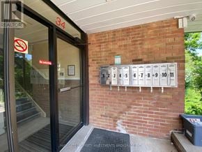 Brampton (Brampton East) multi-family for rent - A brick wall with mailboxes numbered 34 to 11.