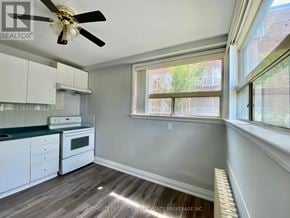 Brampton (Brampton East) multi-family for rent - A well-lit kitchen with a fan and a window.