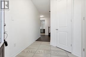 Cobourg apartment for rent - A hallway with white walls and a white door.