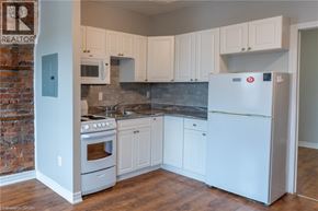 Hamilton townhouse for rent - A kitchen with white appliances and cabinets.