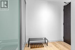 Toronto (Waterfront Communities) condo for rent - A room with a mat on the floor and a door on the right.