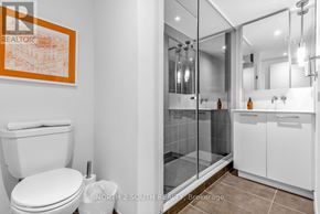 Toronto (Waterfront Communities) condo for rent - A bathroom with a toilet, sink, and shower.