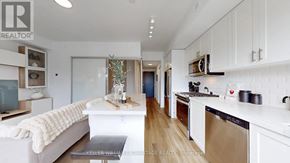 Toronto (O'connor-Parkview) townhouse for rent - A modern kitchen with white cabinets and a stainless steel dishwasher.