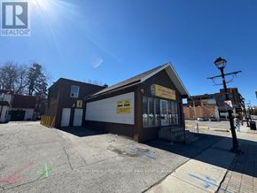 Brampton (Downtown Brampton) apartment for rent - A sunny day at a REALTOR® office with a clear blue sky.