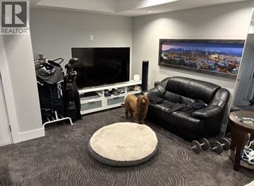 Coquitlam apartment for rent - A dog is standing on a rug in a living room.