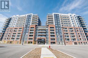 Clarington (Bowmanville) condo for rent - A large, modern apartment complex with multiple buildings and balconies.