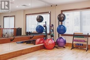 Smiths Falls condo for rent - A room with exercise equipment and a mirror.