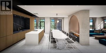 Hamilton (Lakeshore) condo for rent - A modern dining room with a long table and chairs.