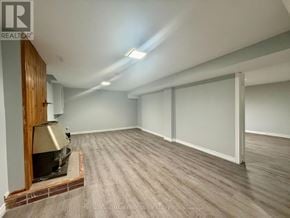 Ajax (South East) apartment for rent - A room with a wood-burning stove in it.