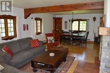 Blue Mountains apartment for rent - A living room with a grey couch and a wooden coffee table.