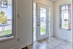 Wasaga Beach apartment for rent - A room with a white door, a window, and a tiled floor.