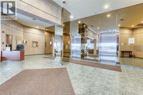 Windsor condo for rent - The image shows a reception area with a brown carpet and a glass wall.