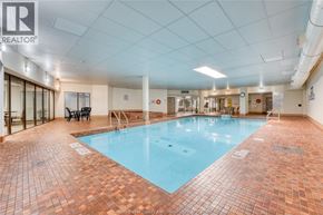 Windsor condo for rent - A large indoor swimming pool with a tiled floor.