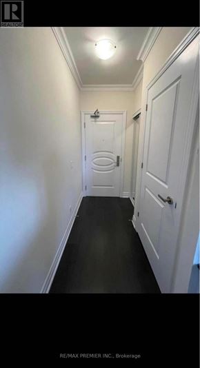 Vaughan (Concord) condo for rent - A hallway with a door at the end.