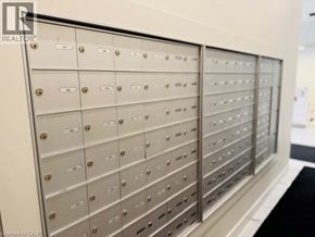 Waterloo condo for rent - A row of metal mailboxes with numbers on them.