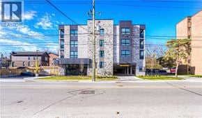 Cambridge apartment for rent - A modern apartment building with a clear blue sky above it.