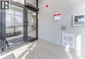 Cambridge apartment for rent - The image shows the entrance to a realtor office with a glass door and a sign on the wall.