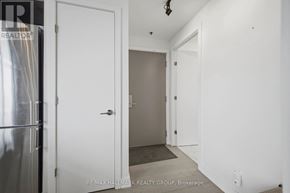 Ottawa condo for rent - A white door is open to a hallway.
