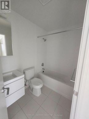 Markham (Unionville) condo for rent - A white bathroom with a toilet, sink, and bathtub.