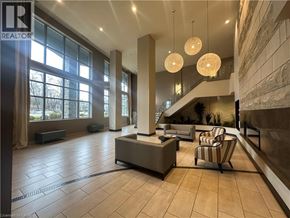 Burlington condo for rent - A spacious lobby with a reception desk and comfortable seating.