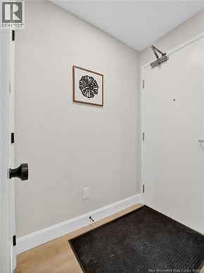 Riverview apartment for rent - A hallway with a rug and a picture on the wall.