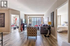Burlington condo for rent - A living room with a brown patterned chair in the center.