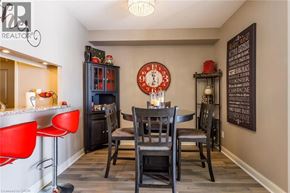 Burlington condo for rent - A dining room with a table set for four.