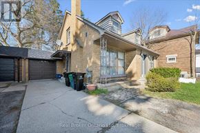 Kitchener multi-family for rent - A house with a driveway and a garage is for sale.