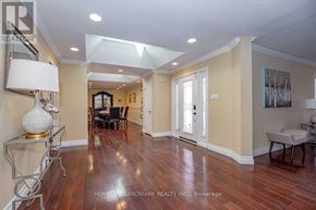 Oakville (Fd Ford) apartment for rent - A spacious room with wood flooring and a dining area in the background.