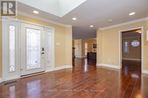 Oakville (Fd Ford) apartment for rent - A spacious room with wood flooring and a skylight.