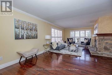 Oakville (Fd Ford) apartment for rent - A living room with a fireplace and a painting on the wall.