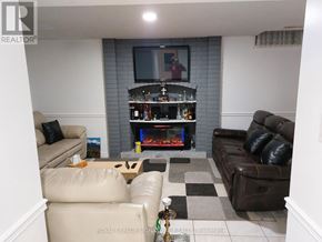 Brampton (Heart Lake West) apartment for rent - A living room with a fireplace and a television.